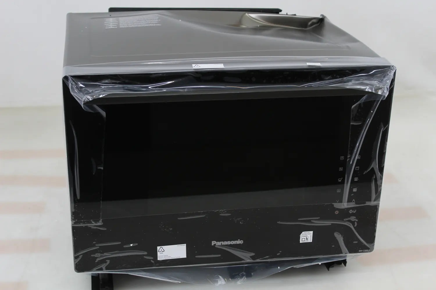 B-Ware Panasonic Mikrowelle Kombimikrowelle Grill Dampfgarer Heißluft 31l Schwarz - 5025232940110